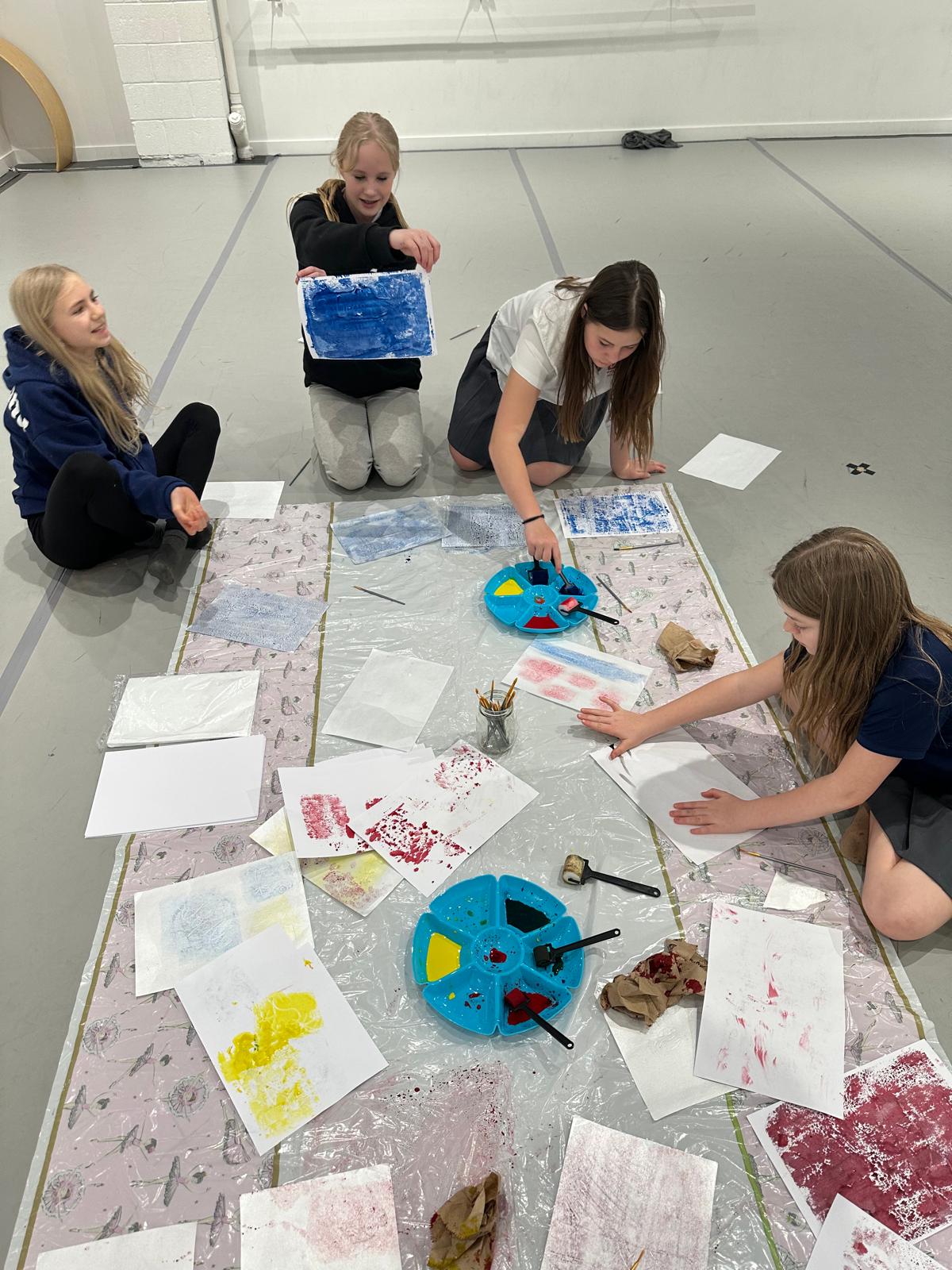 Student artwork and painting materials in the classroom